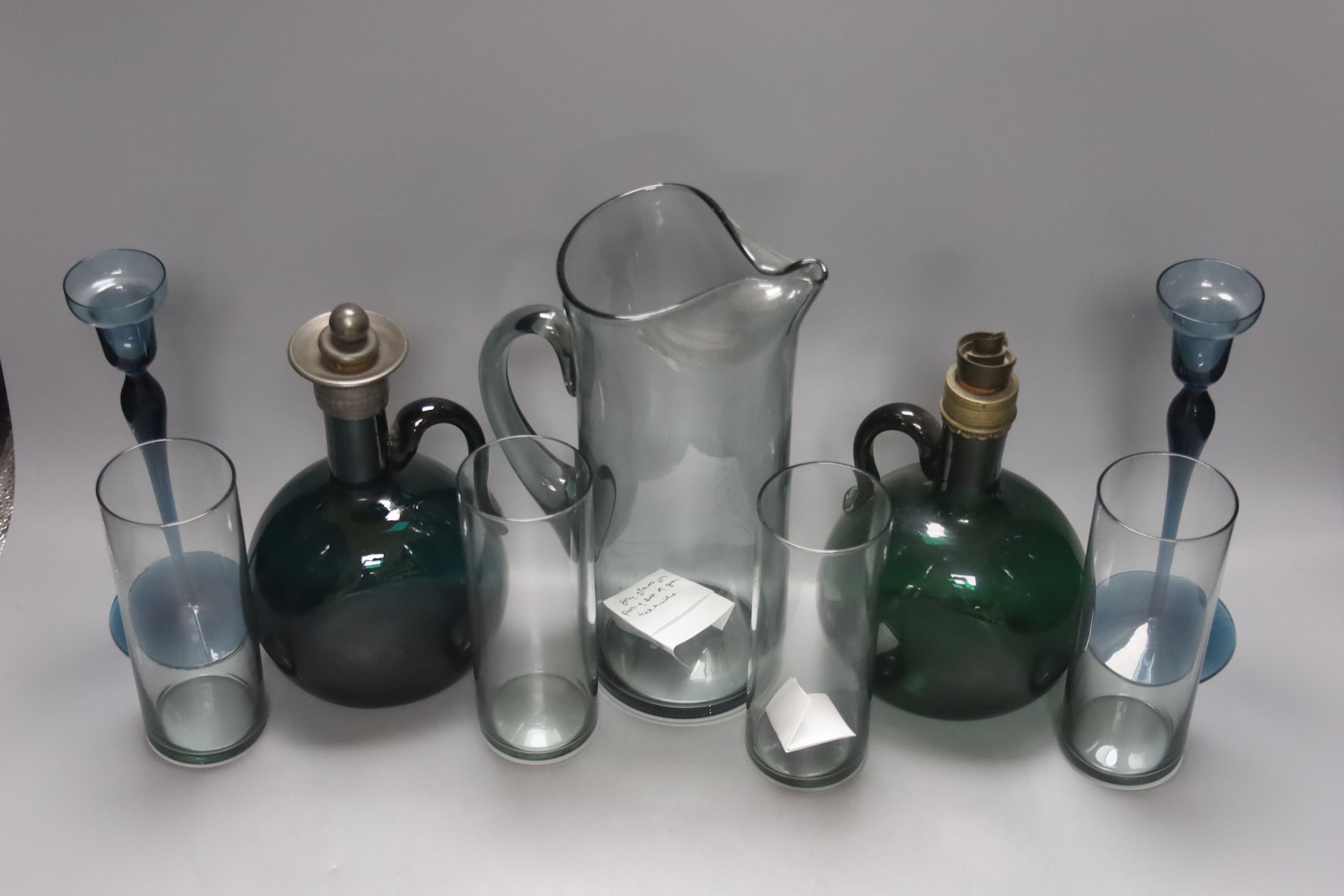Two 19th century green glass hock jugs, a set of six Waterford cut glass tumblers and other glassware